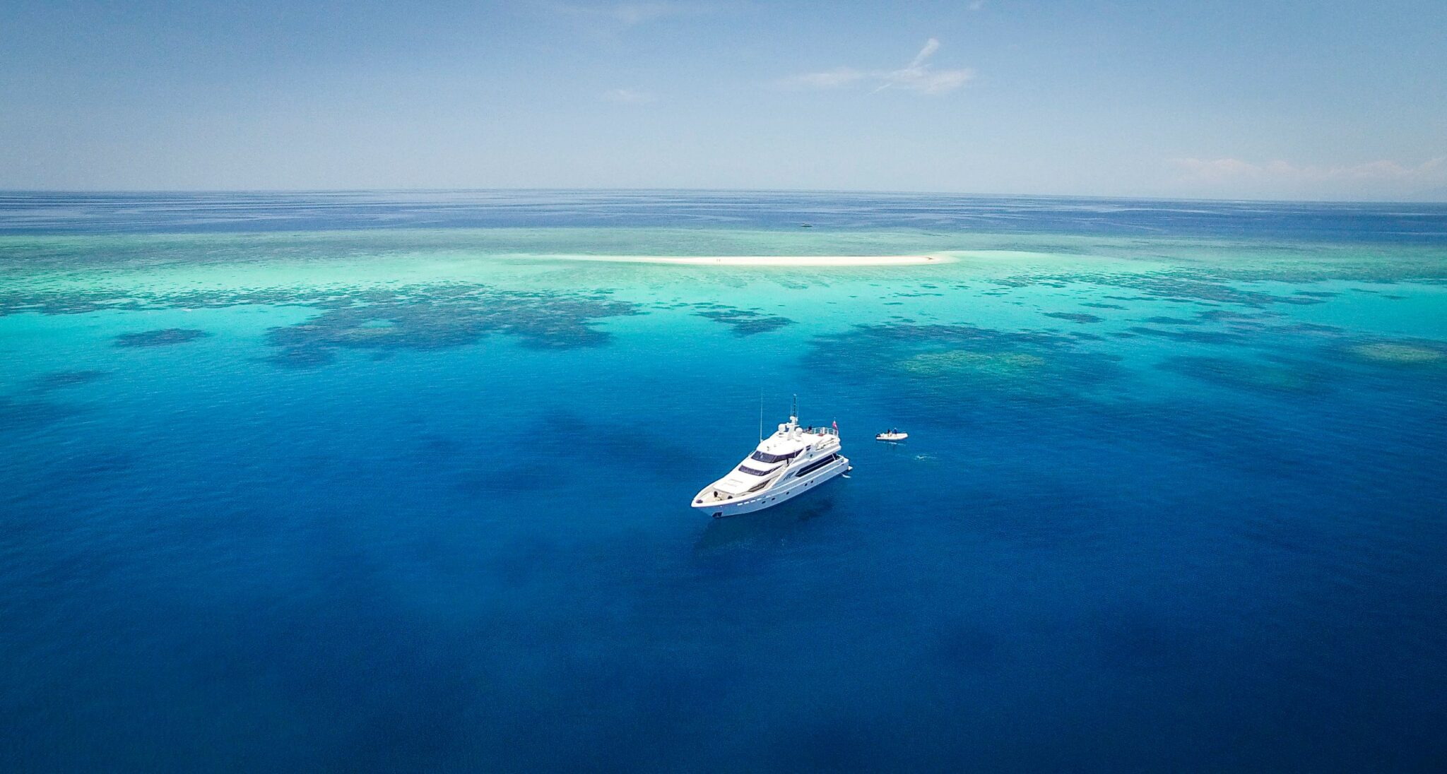 Cairns Luxury Charter Yacht anchored at remote sand cay on the Great Barrier Reef