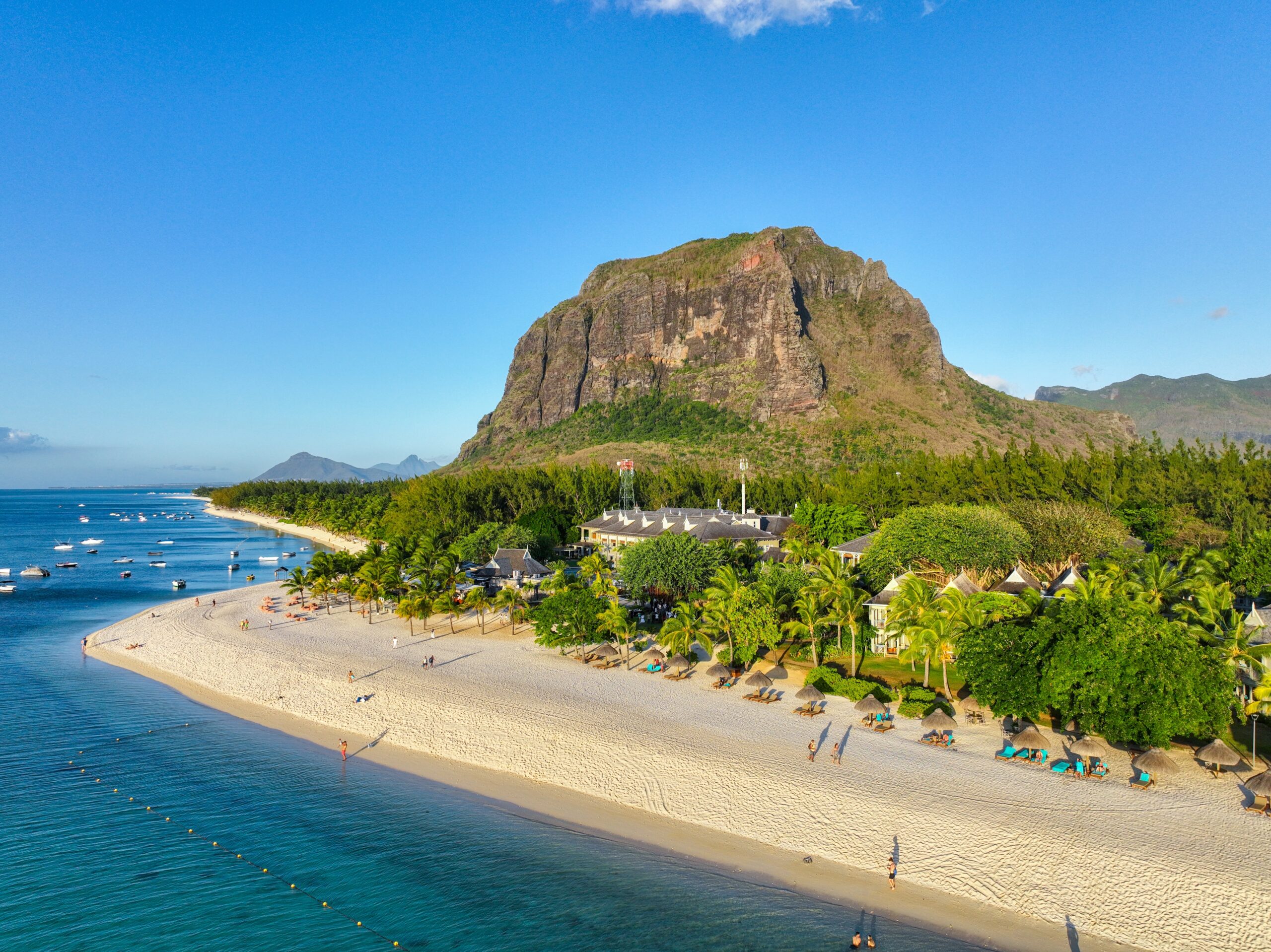 A,Luxurious,Beachfront,Resort,Sits,Below,The,Dramatic,Le,Morne