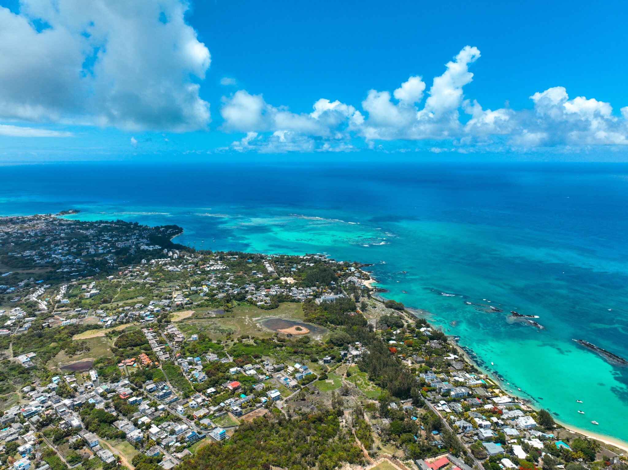 Cap,Malheureux,,Mauritius,Coastal,Lagoon,With,Boats,And,Nearby,Houses