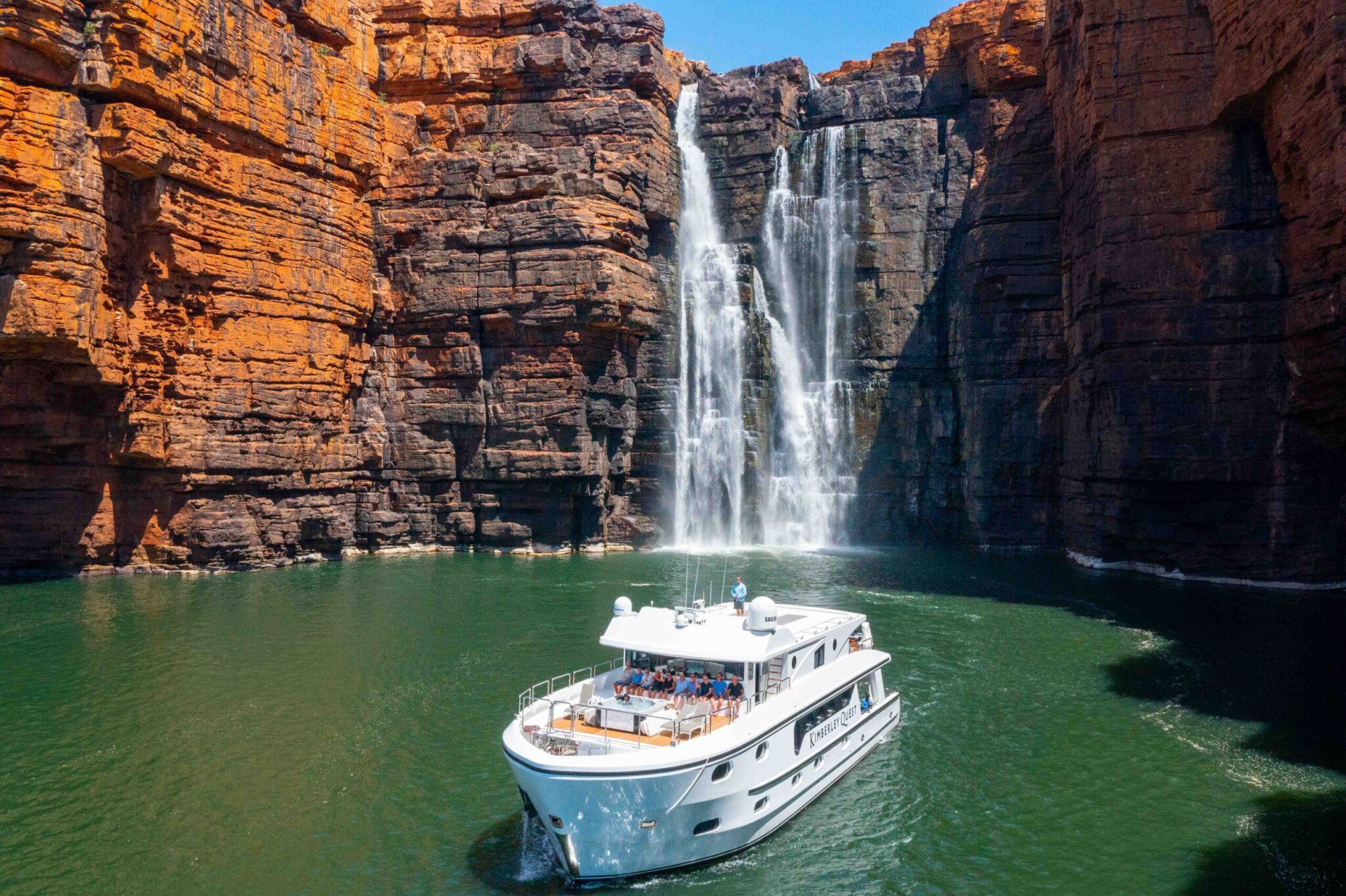 Kimberley Quest at waterfall in the Kimberley_ Private Charter and Kimberley Cruises from Broome