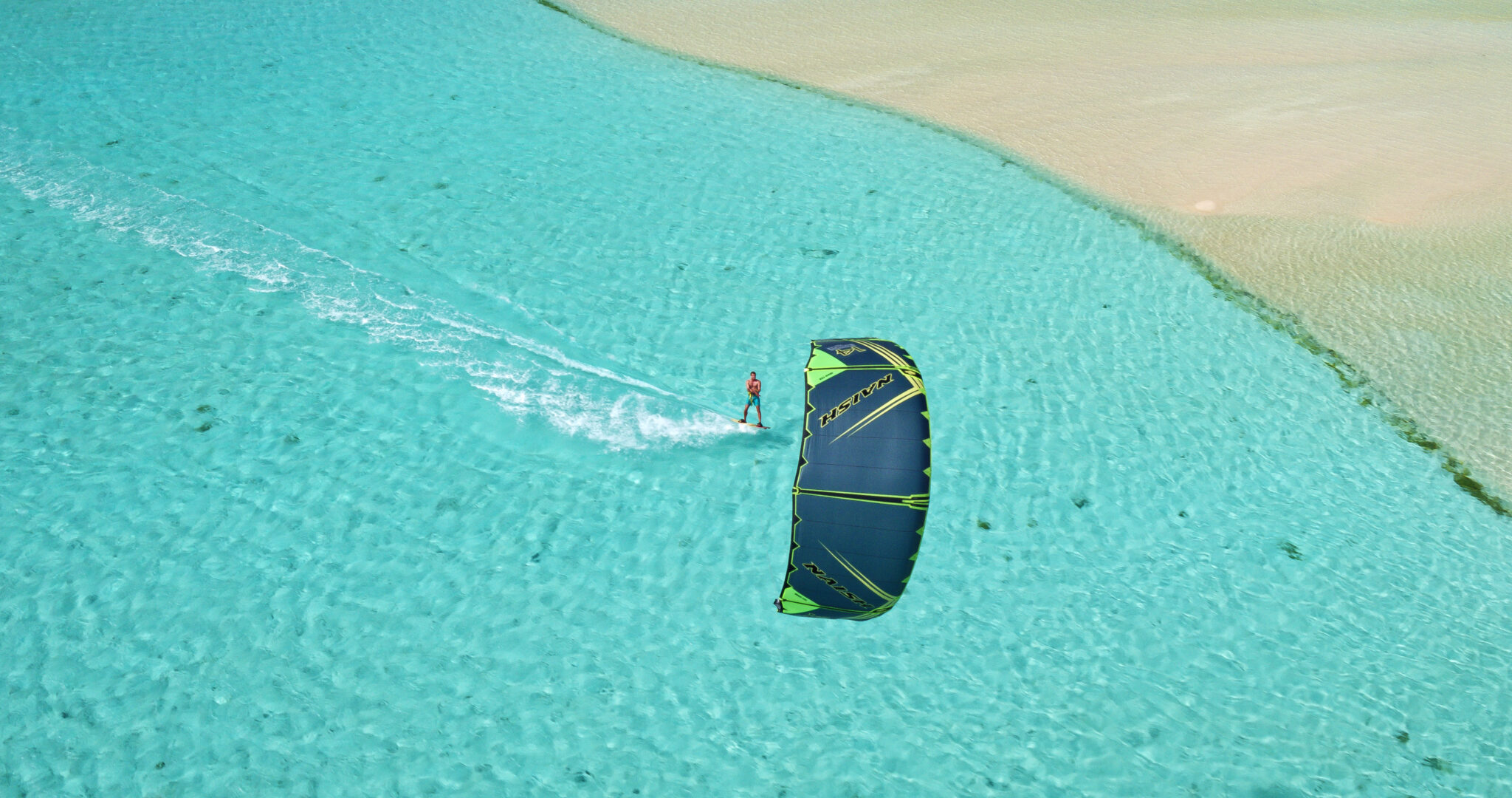 Aerial,View,Young,Man,Kitesurfing,In,Tropical,Blue,Ocean,,Extreme