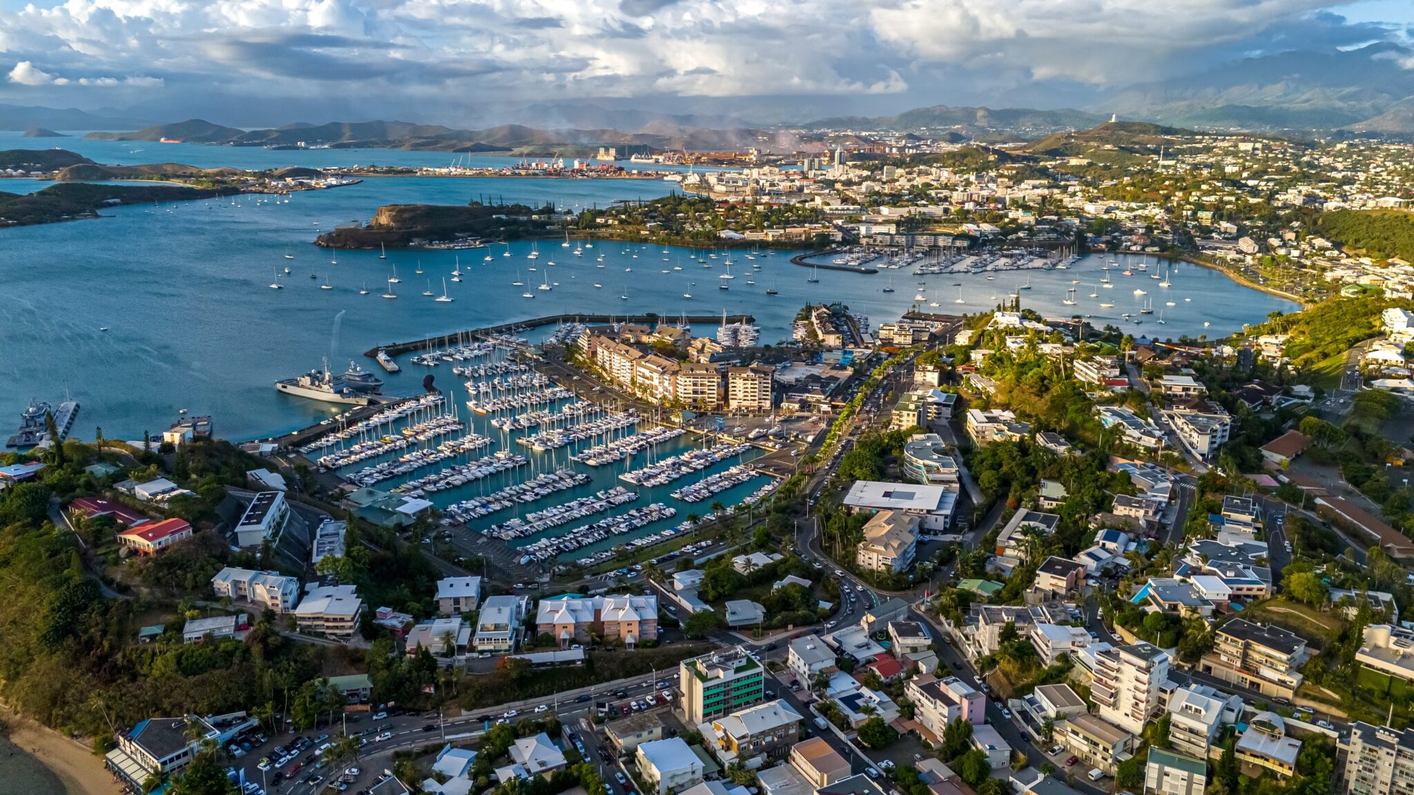 An,Aerial,Drone,View,Focusing,On,The,Bustling,Marina,In