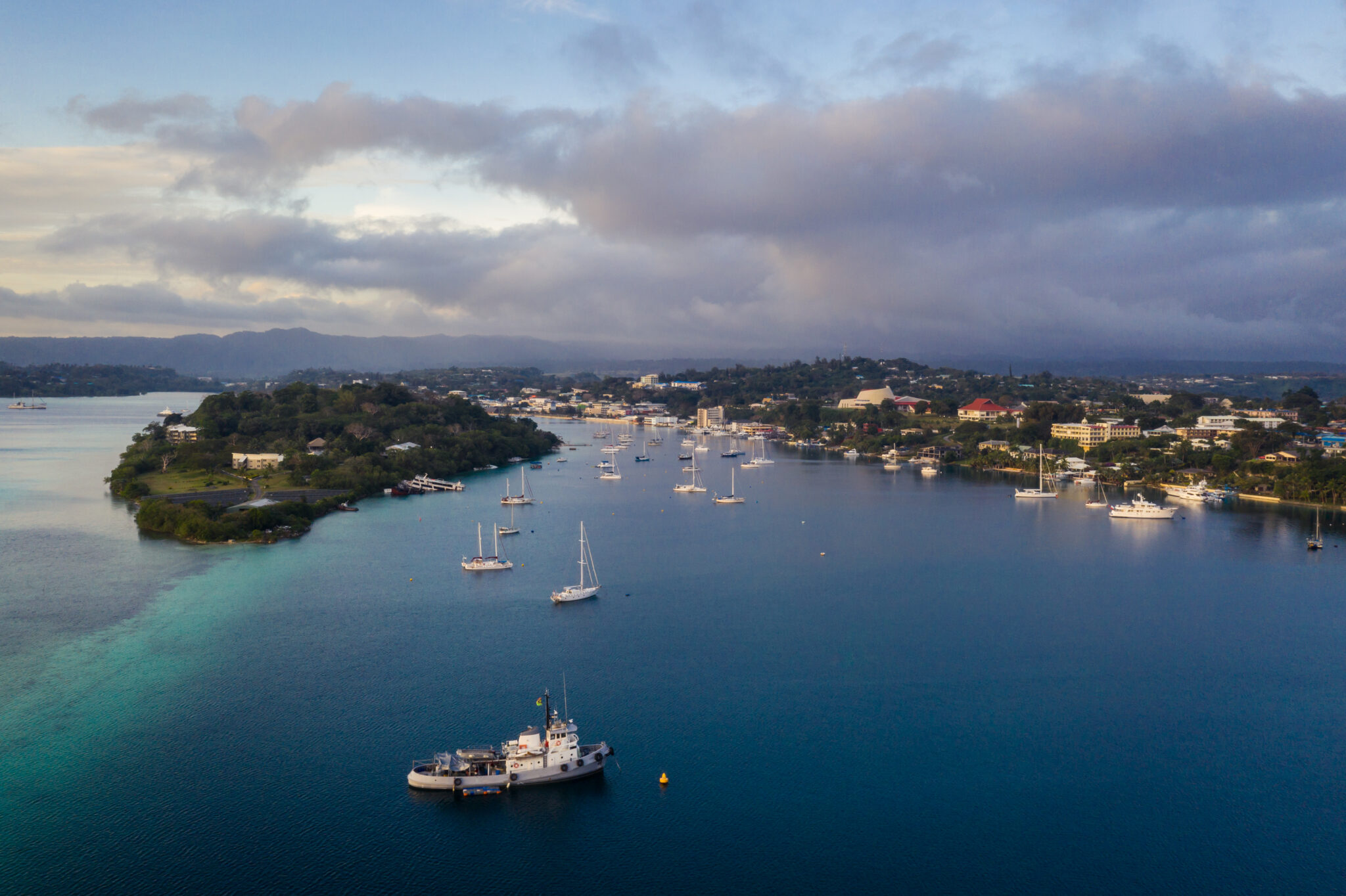 Nightfall,Over,The,Port,Vila,Harbor,With,Sailboat,And,Other
