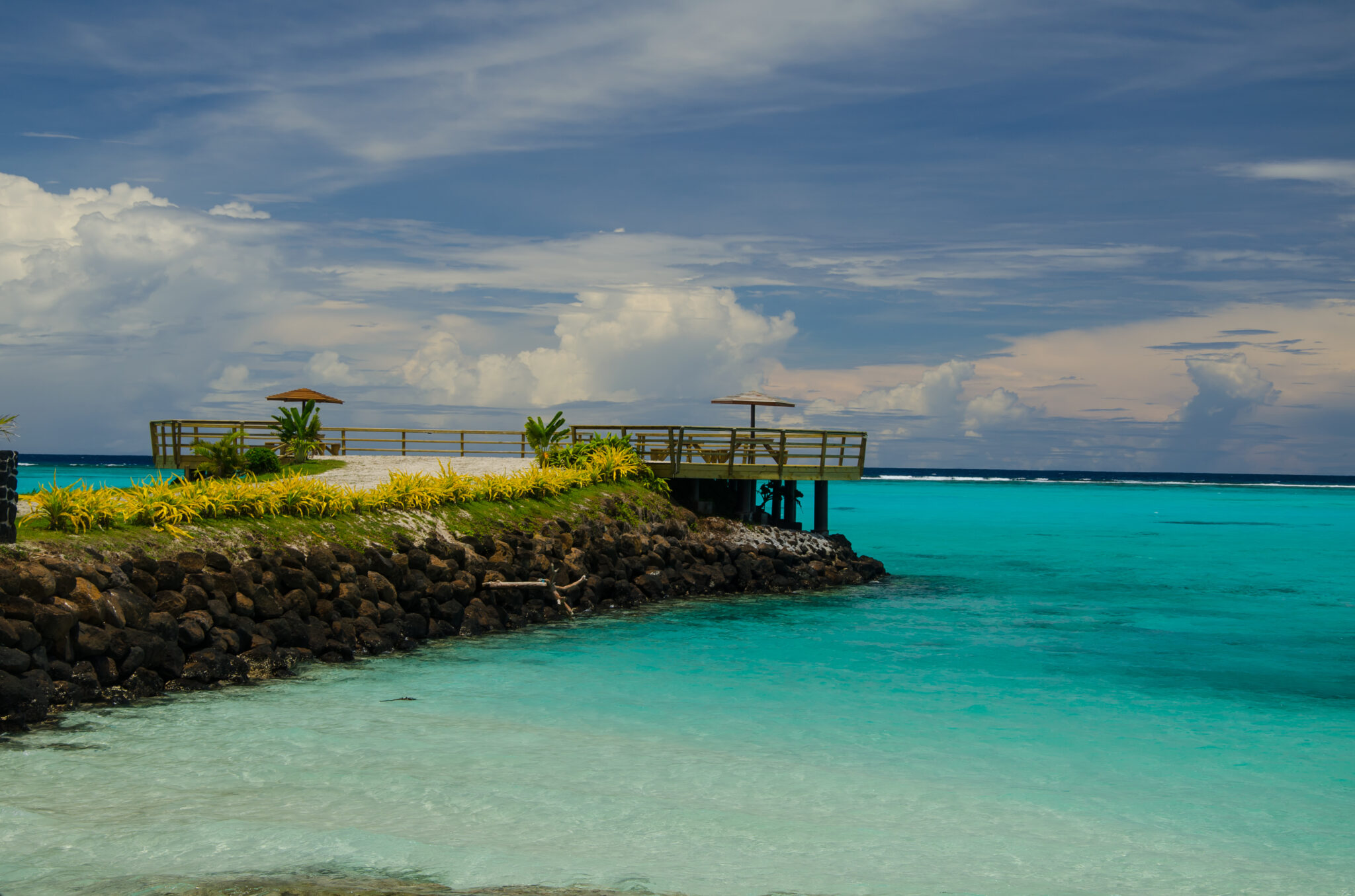 A,Stone,Pier,Surrounded,By,Greenery,And,Sea,Under,The