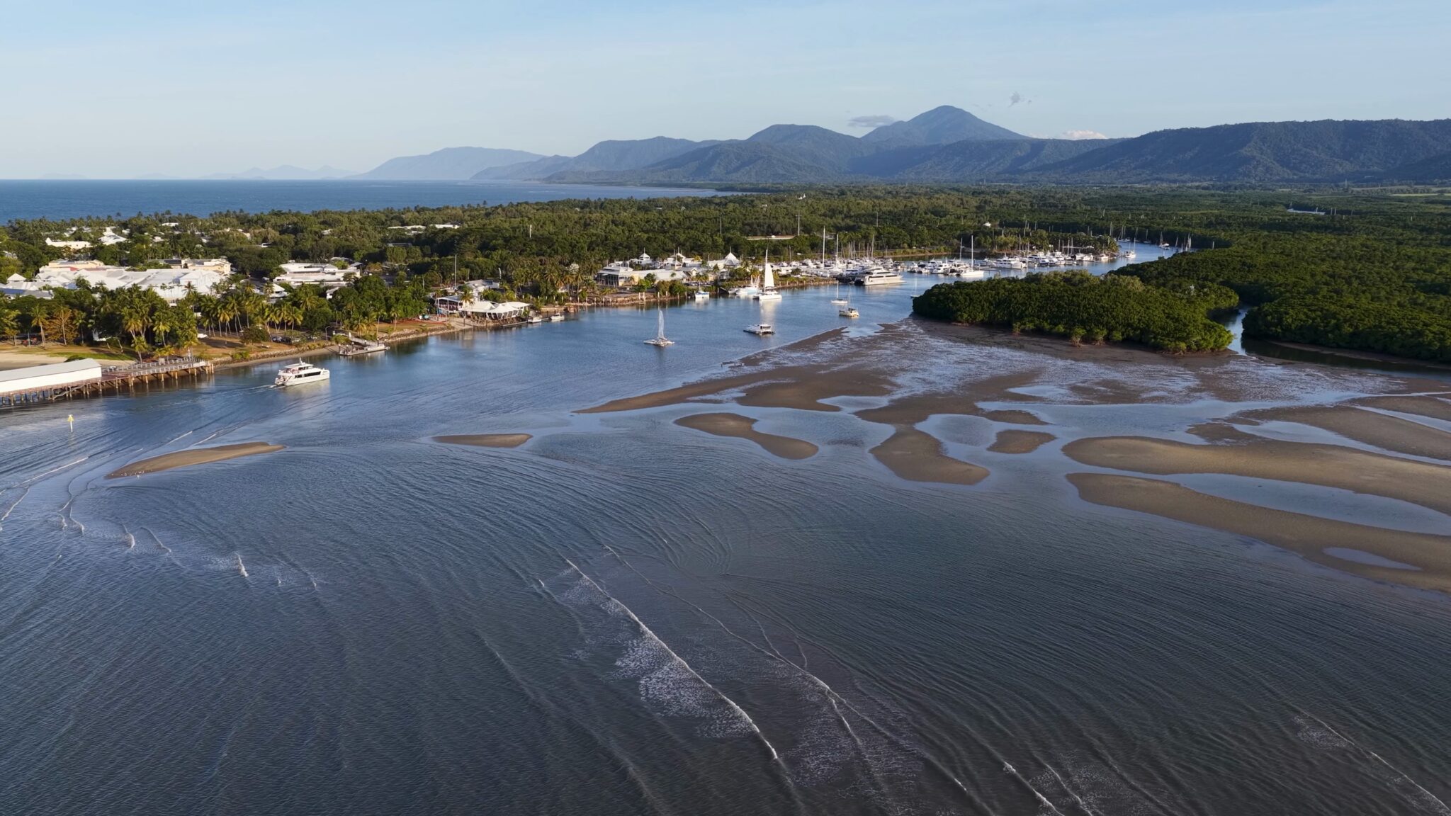 Drone,Shot,Showing,A,Tropical,Coastal,Town,,Marina,,And,Mountains