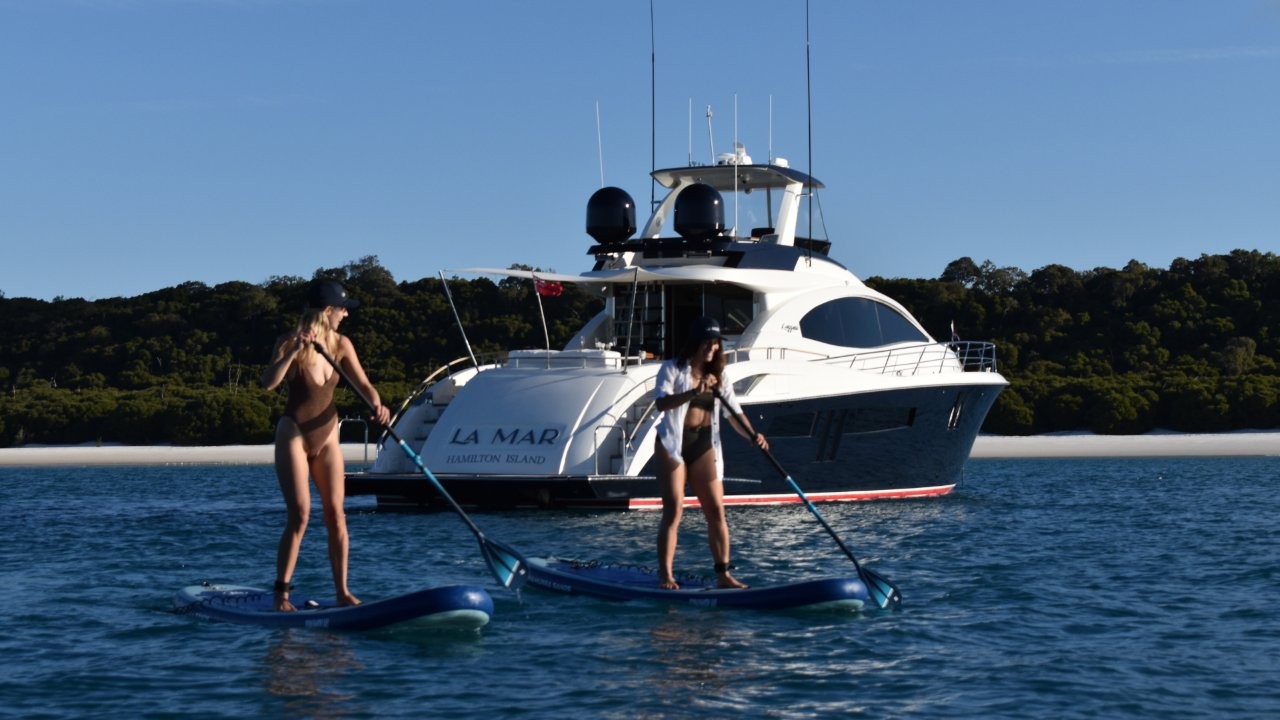 Selection of water activities onboard Hamilton Island luxury charter yacht La Mar at Whitehaven Beach